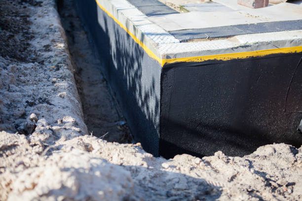 Professional Basement Waterproofing technician working in Newton, IL